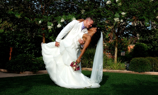 A Happy Groom Dipping His Lovely Bride At The Florida Botanical Gardens